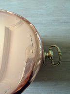 Brass drop-ring handle detail on the copper champagne bucket