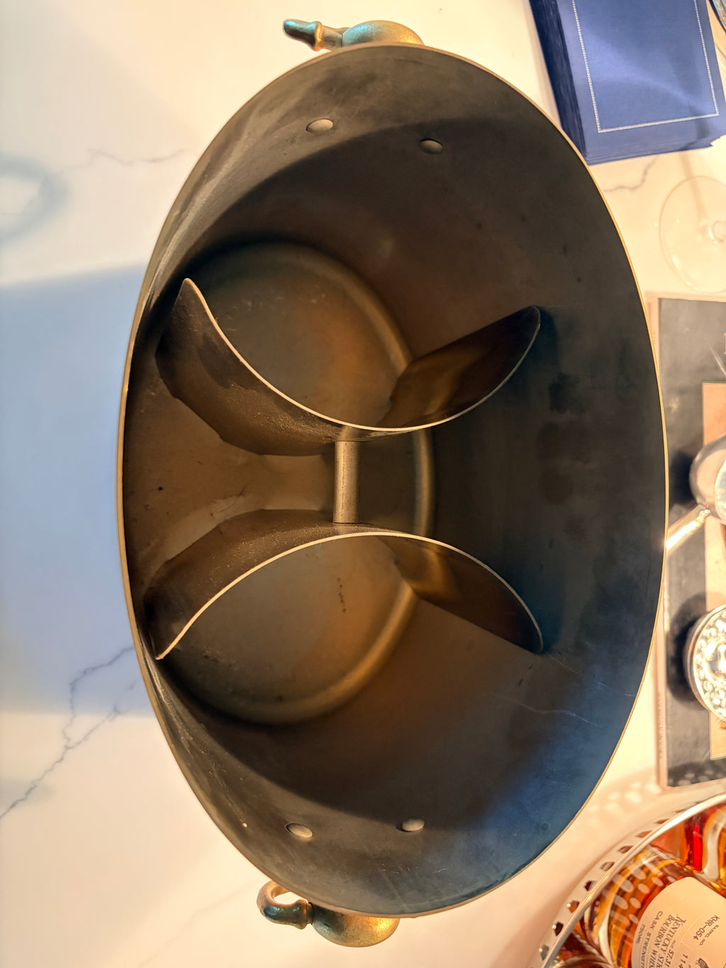 Base of the vintage copper champagne bucket showing age-appropriate wear