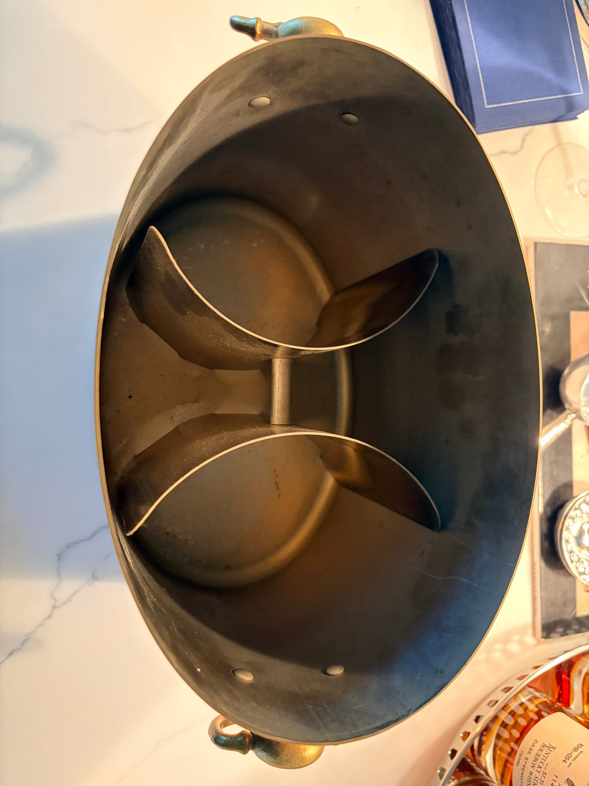 Base of the vintage copper champagne bucket showing age-appropriate wear