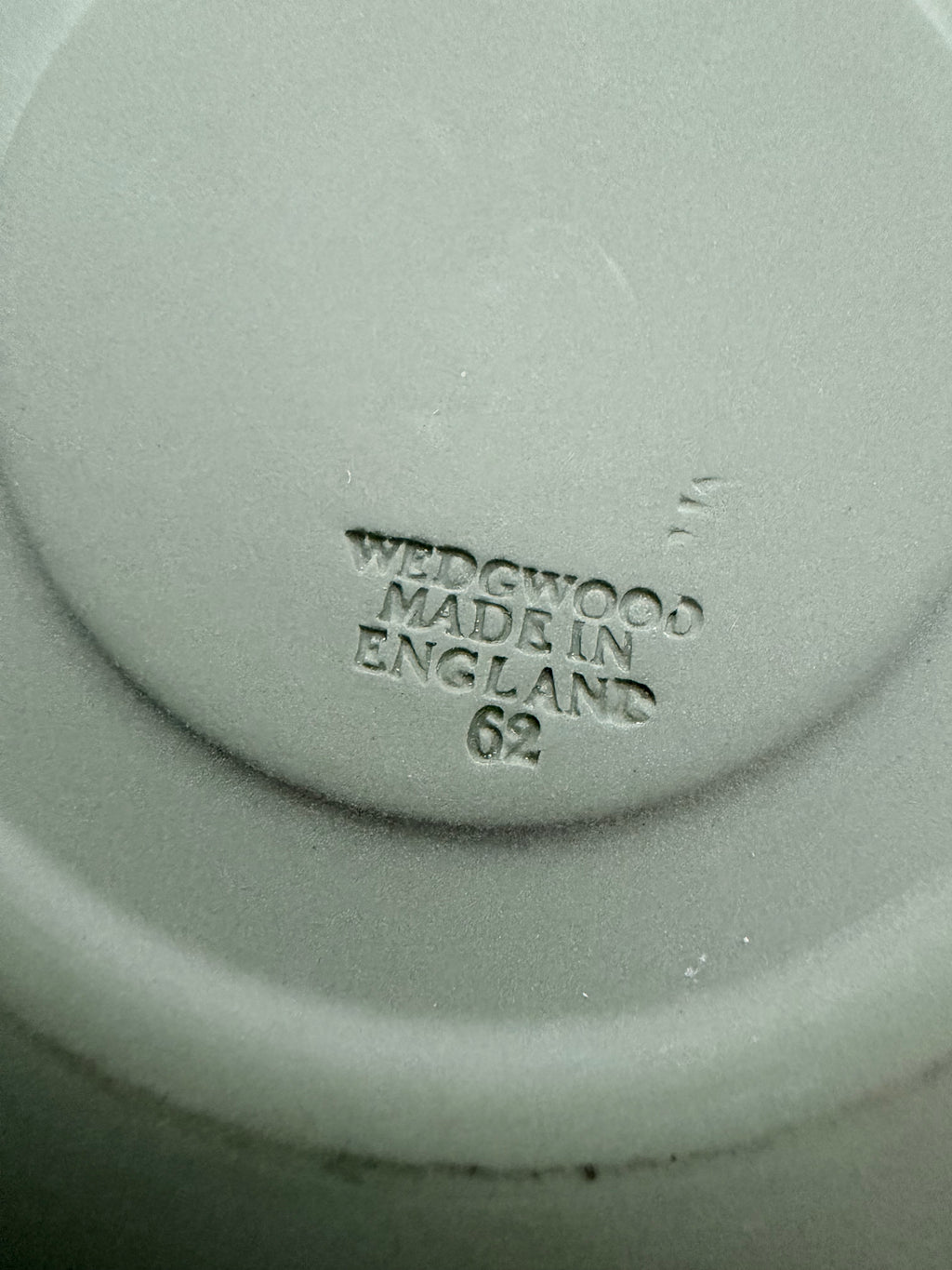 Close view of the cherub relief border on the Wedgwood jasperware saucer