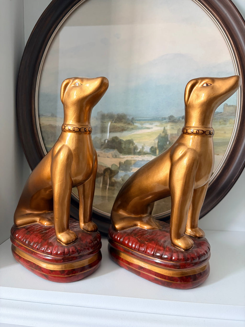 Gold whippet figurine showing the chain-link collar detail