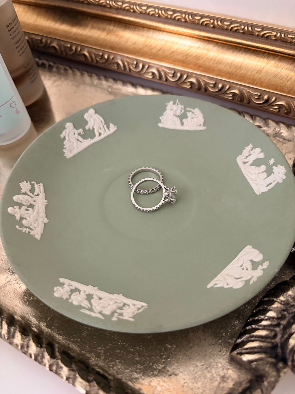 Wedgwood jasperware saucer showing the raised white cherub figures