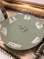 Wedgwood jasperware saucer showing the raised white cherub figures