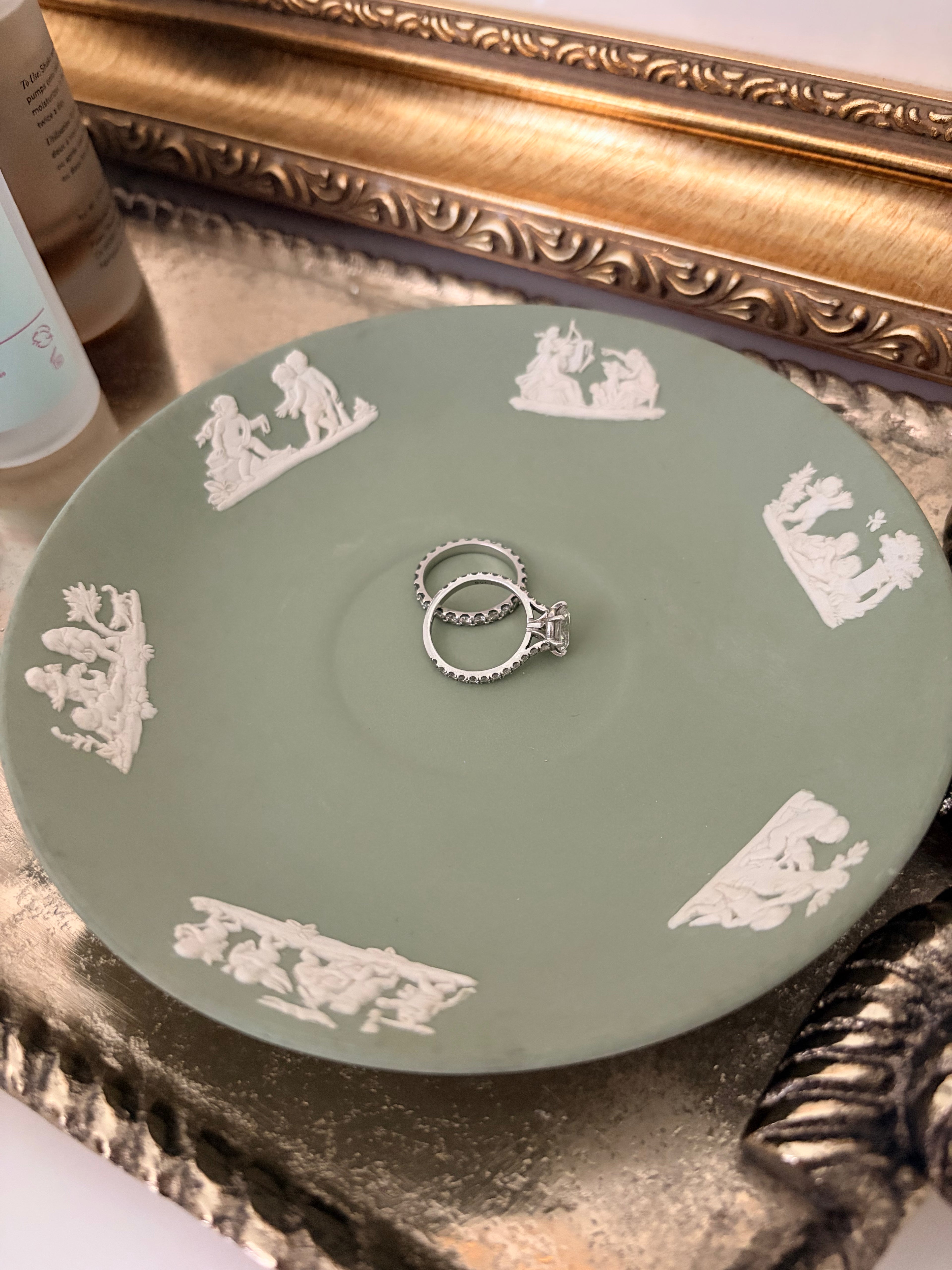 Wedgwood jasperware saucer showing the raised white cherub figures