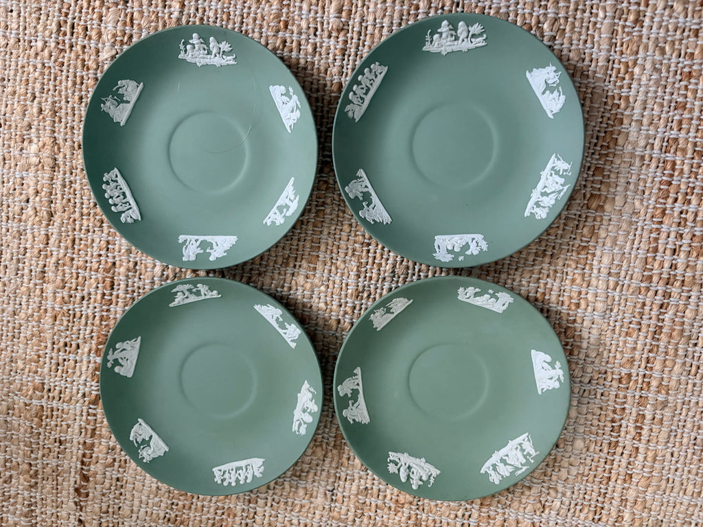 Set of four vintage Wedgwood sage green jasperware saucers with white cherub relief