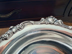 Detail of the Gorham Strasbourg rim showing the scrolling rococo shell and leaf pattern