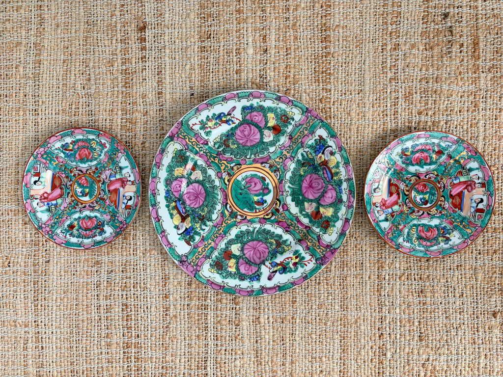 Three vintage Rose Medallion plates arranged as a vertical plate wall trio, one 10 inch and two 6 inch