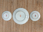 Backs of the three Rose Medallion plates showing the red hand painted in Hong Kong backstamps