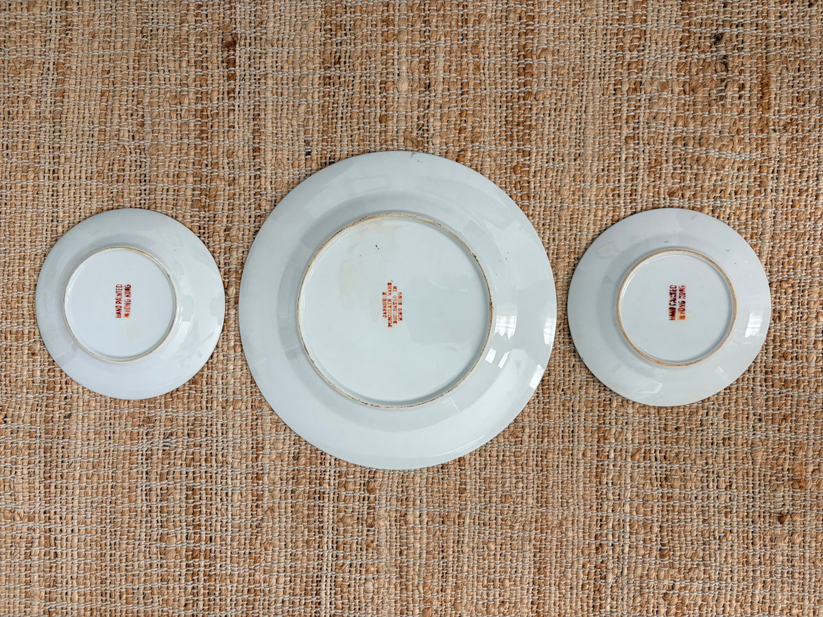 Backs of the three Rose Medallion plates showing the red hand painted in Hong Kong backstamps